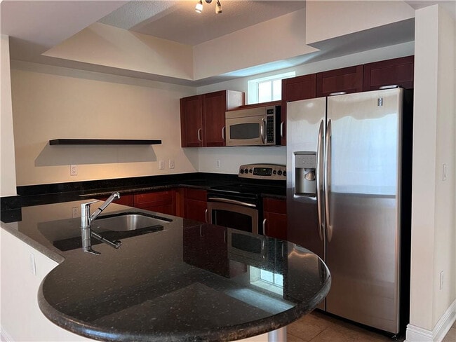 Building Photo - 7275 SW 90th St Unit C309