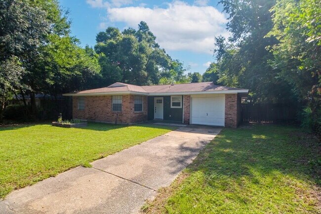 Photo - Updated West Pensacola 3BR Home with Luxury Plank Flooring, Modern Kitchen, 1-Car Garage & Large ...