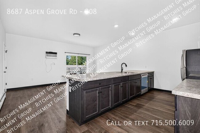 Building Photo - 8687 Aspen Ln Unit 308
