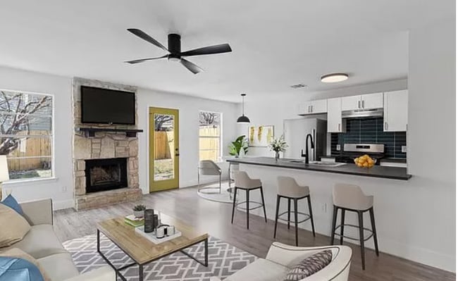 Living Room and Kitchen (Decorations Simulated)