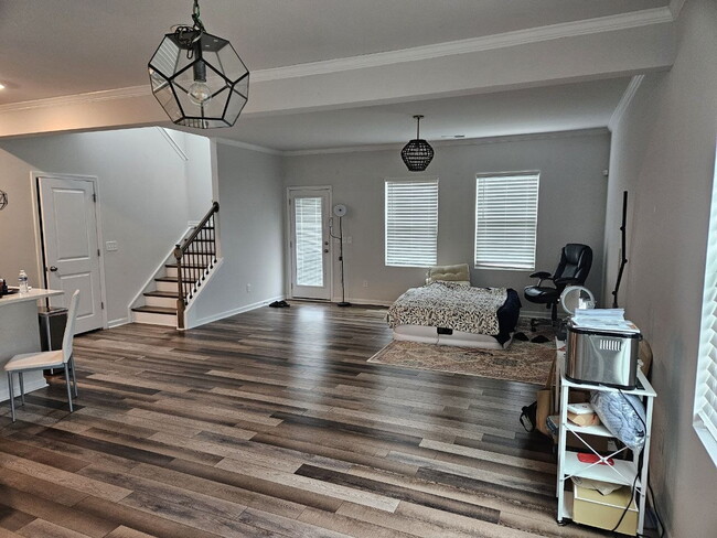 Modern townhome with high-end finishes throughout, minutes to 540 and walkable to great shopping.