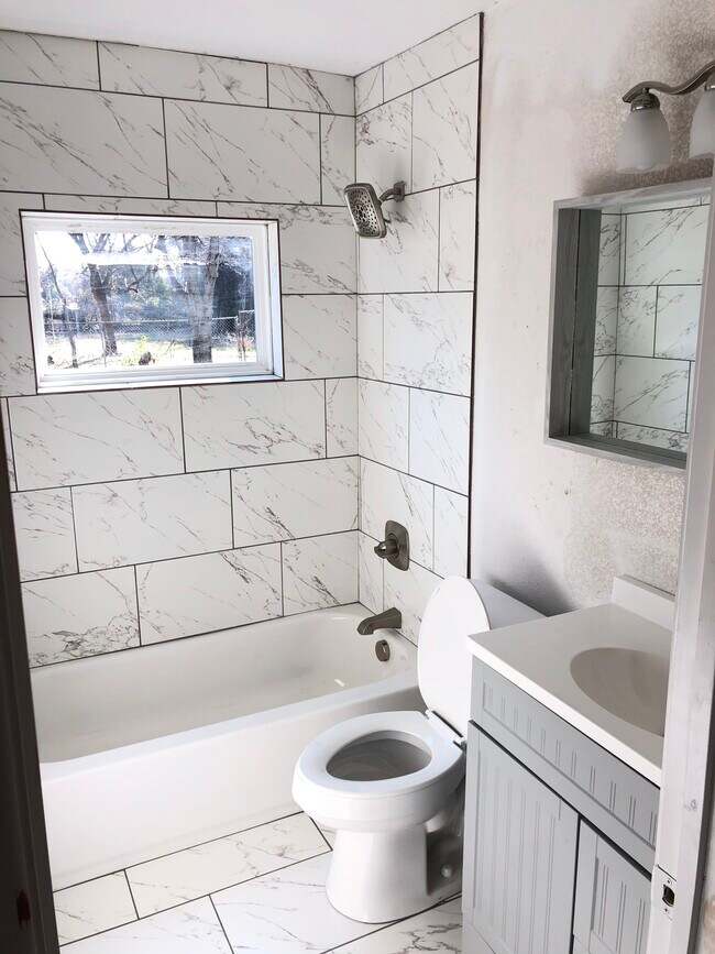 Bathroom with Custom Floor to Ceiling Tile Work - 5313 Sam Calloway DR.