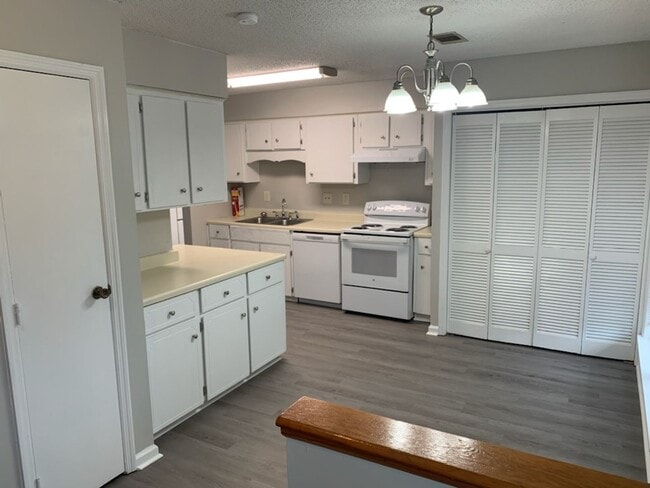 Photo - This charming 3-bed, 2.5-bath townhome is available for rent.