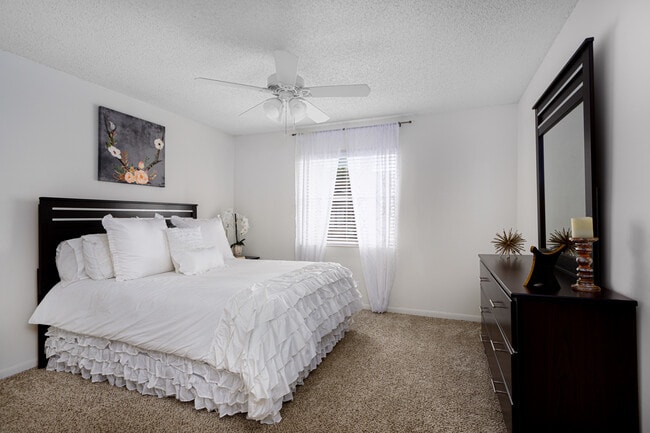 Bedroom with bed and dresser displayed.