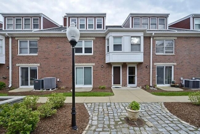Photo - 142 Quincy Shore Dr Townhome