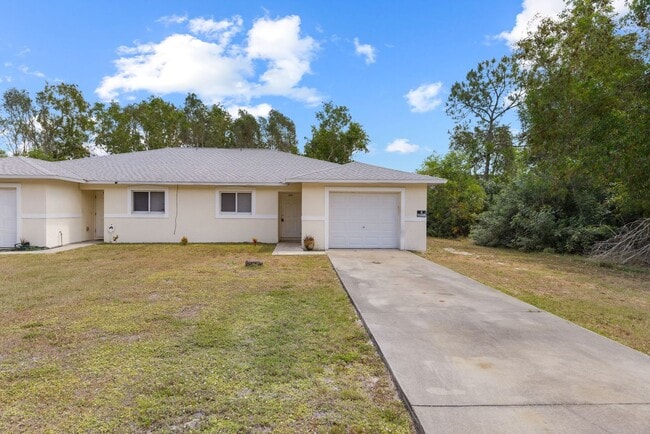 Building Photo - Duplex Lehigh Acres 221 Unit 221 Meadow Rd. Lehigh Acres, Fl 33973