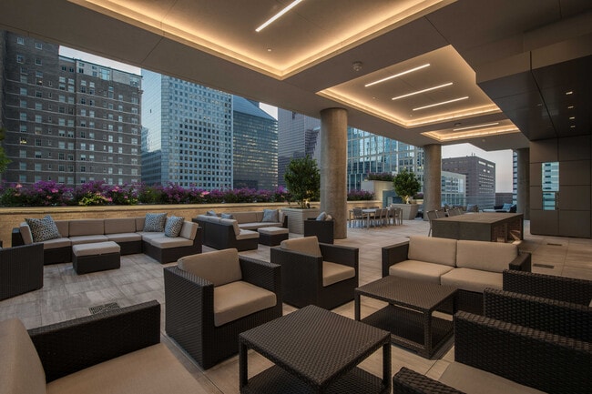 Where city style meets outdoor ease — a chic lounge oasis tucked within the urban skyline. - Aris Market Square