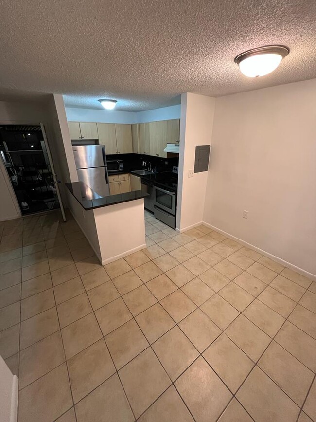 Building Photo - 6935 NW 179th St Unit 204