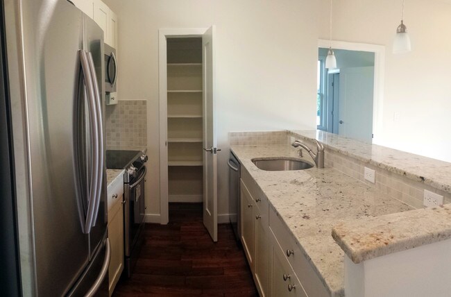A Unit kitchens feature a pantry in addition to ample cabinet space - The Skyler