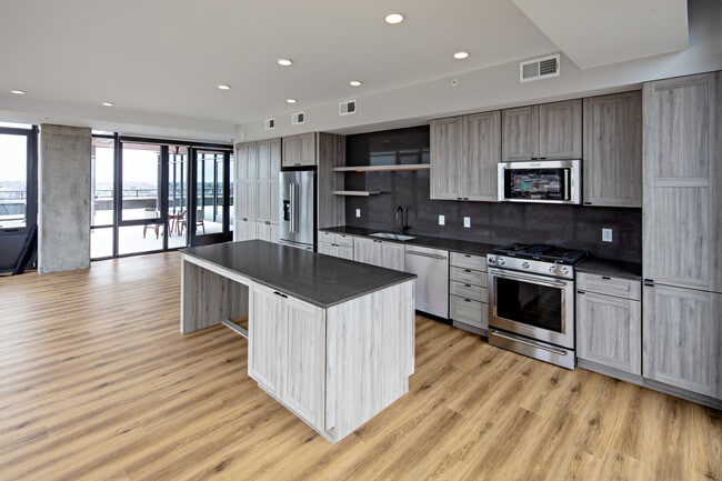 Penthouse-level Signature Collection apartment homes feature kitchens with upgraded finishes and appliances