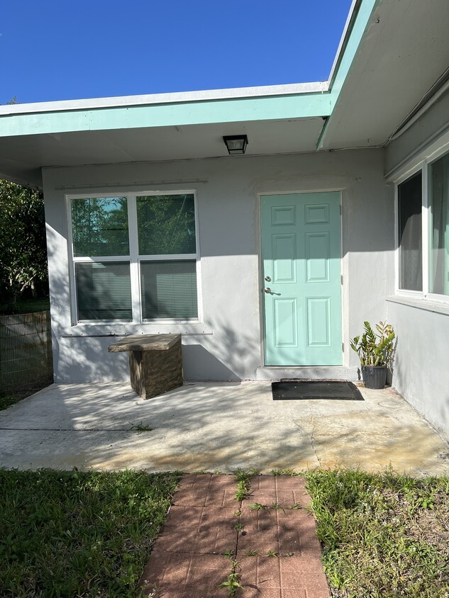 Front Door, Private Entrance with front yard and patio area - 46 Sioux Ln (Atlantis, FL)