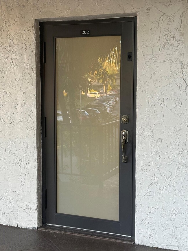 Building Photo - 9360 Lime Bay Blvd Unit 202