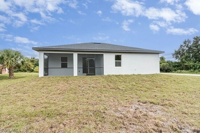 Photo - Stunning 3BR/2BA Home with 2-Car Garage & Screened Lanai in Lehigh Acres
