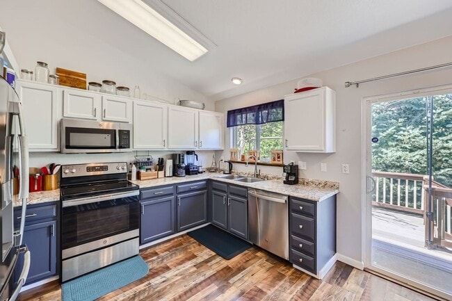 Photo - Evolve Real Estate: Fantastic Home with Large Yard Available for Move in on August 2nd