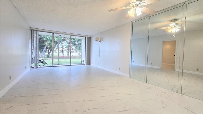 Building Photo - 8421 Lagos de Campo Blvd Unit 106