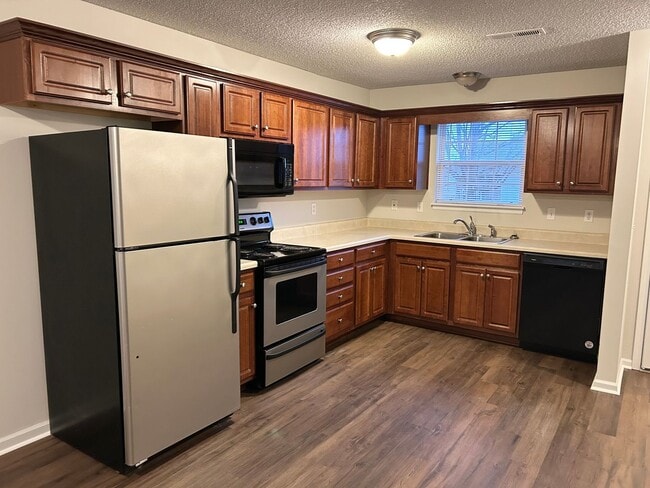 Photo - 3 Bed 2 Car Duplex in Grain Valley (New Flooring, Carpet, and Paint)