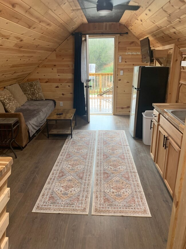 View from inside living area towards the front door and deck - 135 Lock Seven Ln