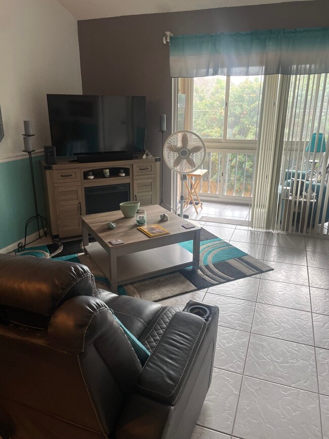 Living Room and Screened in Porch - 6424 Spring Flower Dr Unit 25