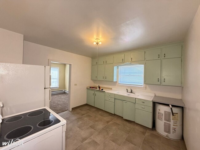 Photo - Cozy 2-Bedroom Home with Fenced Yard & Rear Parking!