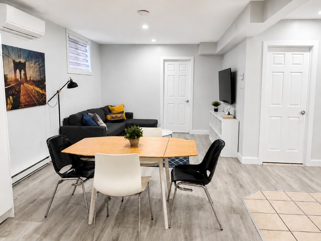 Open living areas - 203 Rue Dollard-Des Ormeaux Unit Furnished 2BR / 1BA Apartment