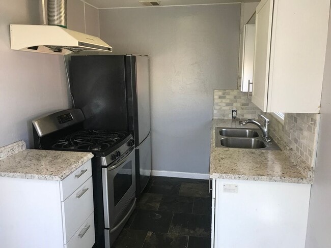 Building Photo - 1 month free rent! Private yard and storage shed.