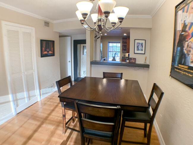 The dining area connects to the kitchen with open bar. Great for hosting. - 2425 Ashdale Dr Unit 75