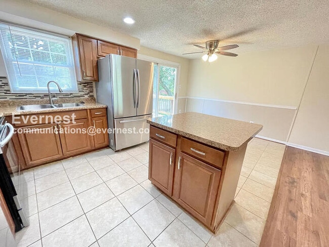Photo - 3 Bed, 2.5 Bath Home with Fenced Yard & Garage / Pet-Friendly / Available Now!