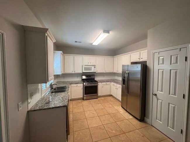Alpharetta 4 bedroom home with large fenced in backyard