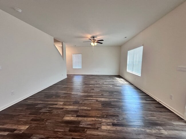 Photo - efficient two-level home provides a large living room, 4 very spacious bedrooms, and 2.5 bathrooms