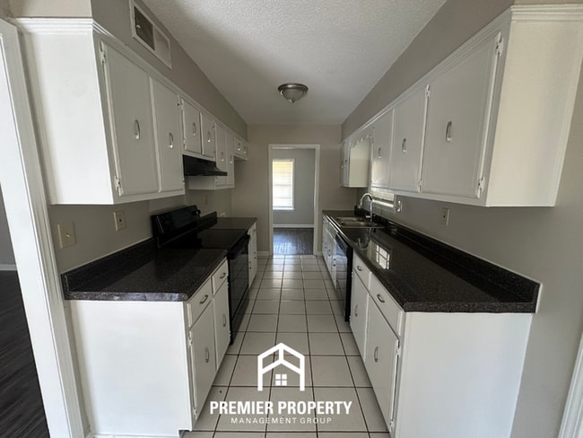 Photo - Gorgeous 4BR/2BA Bartlett Home with Brick Fireplace & Spacious Fenced Yard!