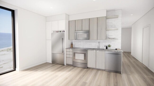 Stainless steel appliances at Modera Revere Beach add a sleek, modern finish to every kitchen. - Modera Revere Beach