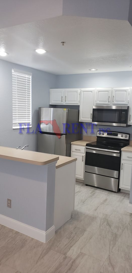 Photo - 4 BR / 3 FULL BATH (INCLUDES 2 MASTERS) 2 STORY (NEAR DISNEY!) GATED COMMUNITY WITH COMMUNITY POO...