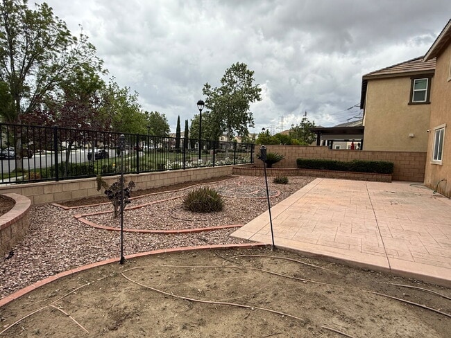 Photo - New flooring & paint!  Large backyard - landscaped and ready for garden!   Community pool, fitnes...