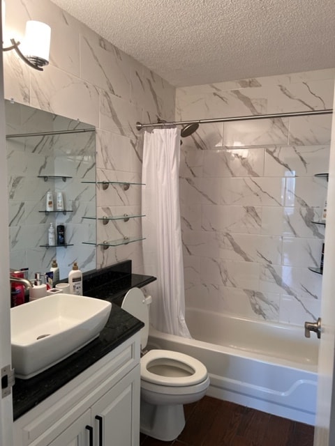 Newly redone bathroom with brand new tiling, toilet, granite, and vanity sink - 440 N Wabash Ave Unit 2501