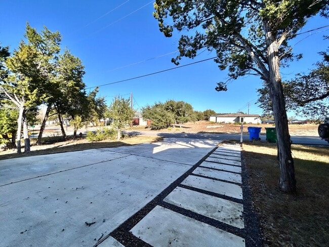 Photo - Charming 4/BR 2/BA Home with 2-Car Garage and Private Fenced Backyard