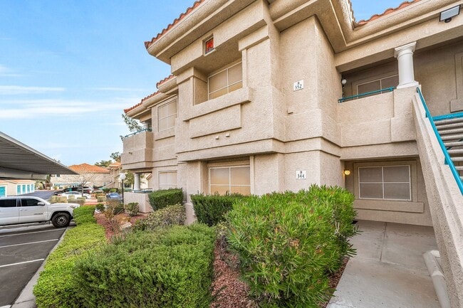 Photo - Light-Filled Dual-Suite Condo with Soaring Ceilings, Fireplace & Private Balcony in Amenity-Rich ...