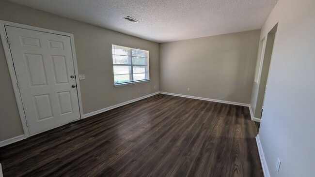 Photo - Fenced Yard, Lots of Light, Hard Floors Throughout
