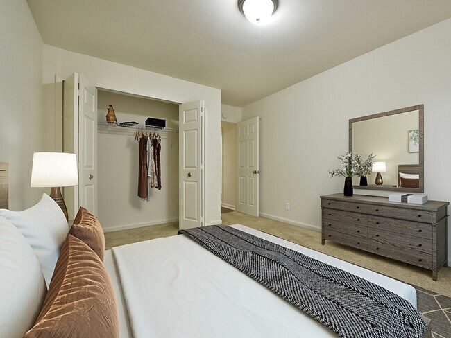 A large bedroom with a closet.