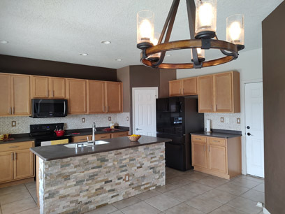 Kitchen with stacked rock island - 3544 Plano Vista Rd NE House