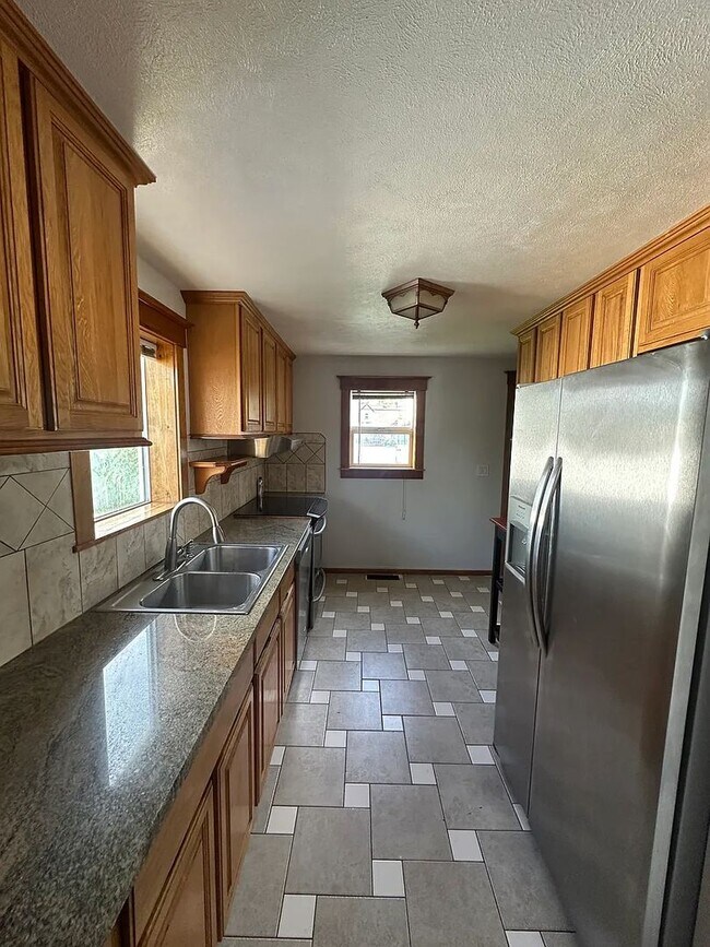 Photo - Ideally Located and Updated 4 Bed 2 Bath Fully-Fenced Home w/ Detached Garage/Shop!