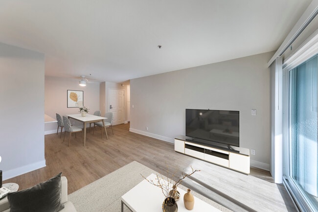 Renovated Package I dining and living room with hard surface flooring