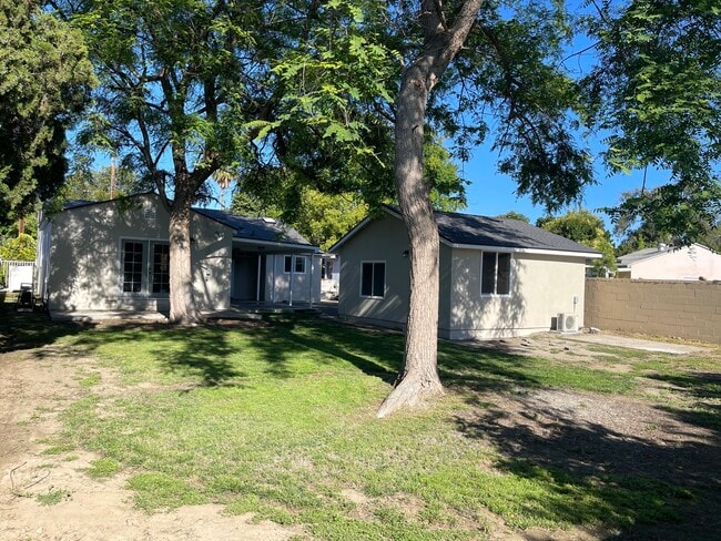 Large shaded enclosed backyard