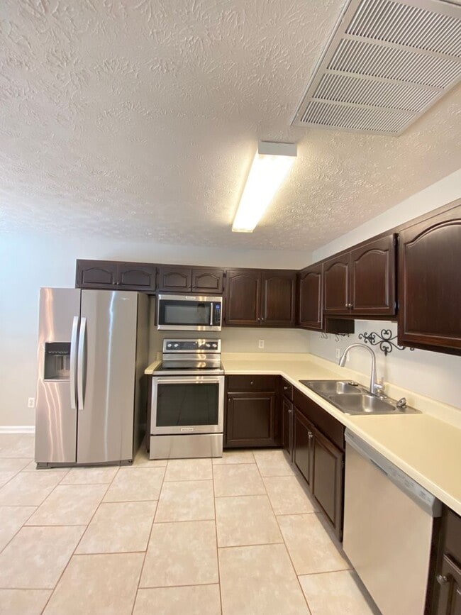 Photo - Updated 2BR/2BA Duplex with Fenced Yard & Lawn Care Included