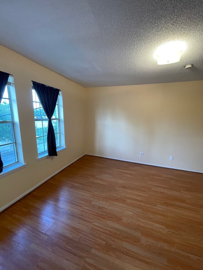 Bed, couch, desk - 3118 San Jacinto St Unit 12