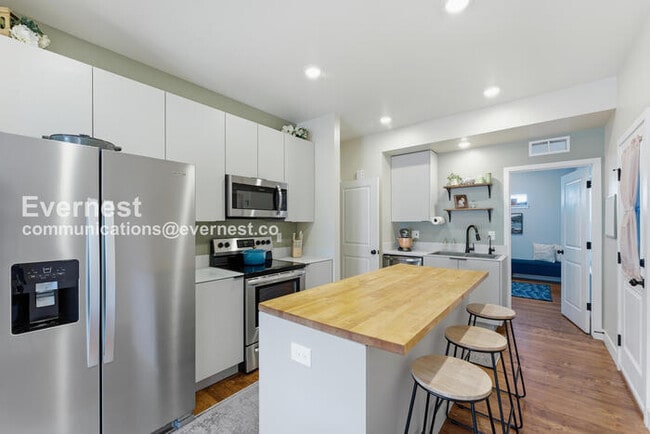 Photo - 4 Bed/3 Bath Townhome with Fenced Yard & Garage / Available Now!