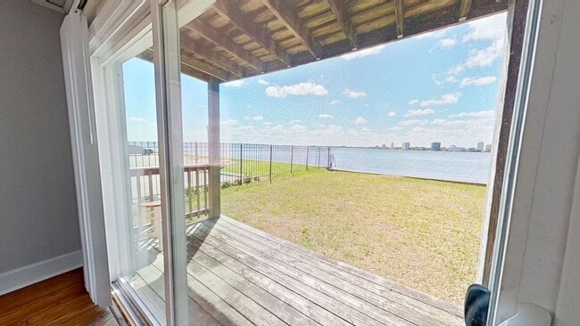 Building Photo - Riverfront Living! First Floor Unit w/ Private Patio, Stunning Views & Upgraded Kitchen
