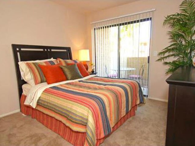 Bright Bedroom Space with Patio Access - Acacia Pointe