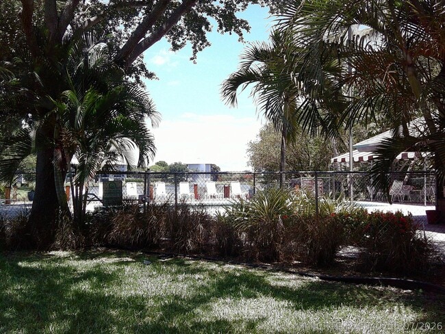 Building Photo - 9420 Poinciana Pl Unit 409
