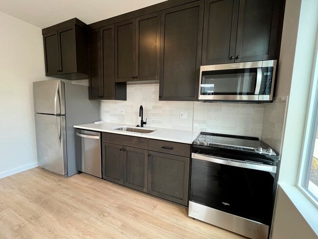 Photo - Stunning Modern Townhome-Style Unit with Washer/Dryer Included, A/C!