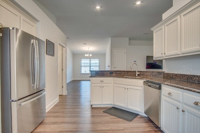 Photo - Spacious 4BR/2BA Brick Home with 2-Car Garage, Granite Kitchen, Vaulted Ceilings & Fully Fenced B...
